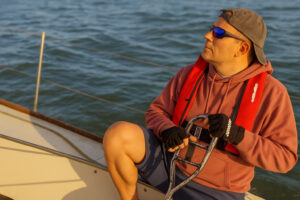 Image shows Paul, the owner of Headway Marketing, sailing off the coast of Portsmouth